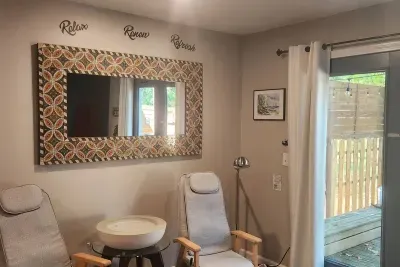 Traverse City Bungalow Spa Retreat Queen Bedroom | Dual Massage Chairs | French Door Access to Deck | Smart TV | Spa Robes, Towels & Slippers