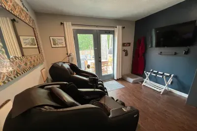 Traverse City Bungalow Spa Retreat Queen Bedroom | Dual Massage Chairs | French Door Access to Deck | Smart TV | Spa Robes, Towels & Slippers