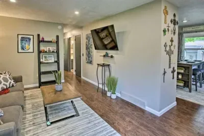 Sit back and stream a movie on the Smart TV. Hardwood floors complete this space.