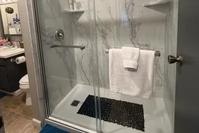 Traverse City Bungalow Spa Retreat | Full Bath Tub Shower Combo | Adventure North Vacation Rentals | Wake up with a morning shower!
