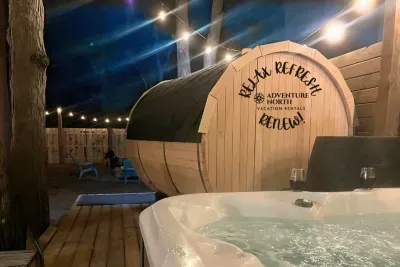 Unwind at the Traverse City Bungalow Spa Getaway! Experience the Outdoor Hot Tub, Barrel Sauna & Cold Plunge Barrel all contained within a String Lit, Private Fenced Back Yard- complete with a Fire-pit- the true Northern Michigan Package!