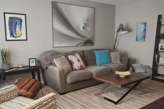Feel at home relaxing in this house's inviting living room. Enjoy a great book in the reclining chair.