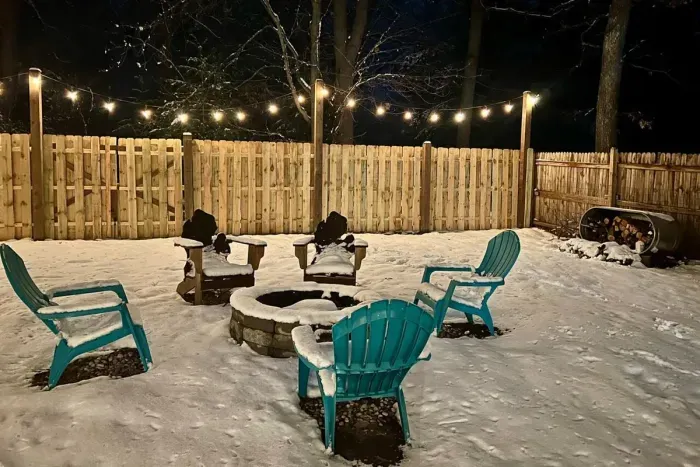 Traverse City Bungalow Spa Retreat | Adventure North Vacation Rentals | Back Yard Fire-PIt | String Lights | Fully Fenced
