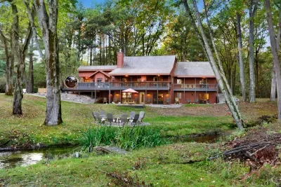 Hall Creek Lodge Large Group Spa Retreat | Interlochen, MI | Adventure North Vacation Rentals | 6BR 6BA | Hot Tub | Barrel Sauna | Massage Chairs | Steam Shower | Fire-Pit | Main House and Gue