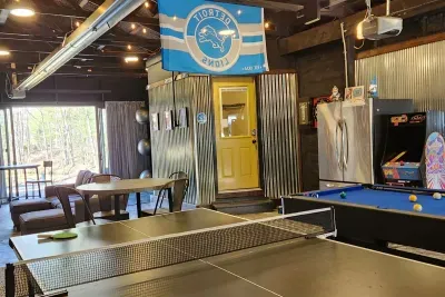 Hall Creek Lodge Large Group Spa Retreat | Adventure North Vacation Rentals | Guest House Restore the Roar Recreation Room | Pool Table | Ping Pong | Arcade Games | Darts | Extra Refrigerator