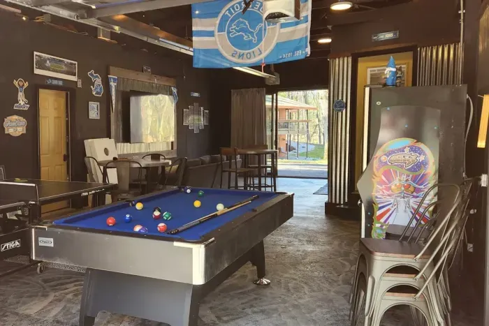 Hall Creek Lodge Large Group Spa Retreat | Adventure North Vacation Rentals | Guest House Recreation Room | Pool Table | Ping Pong | Arcade Games | Darts | Extra Refrigerator | Smart TV's | Wo