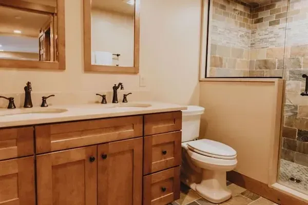 Bathroom 3 is on the lower level and is shared by bedrooms 3 and 5