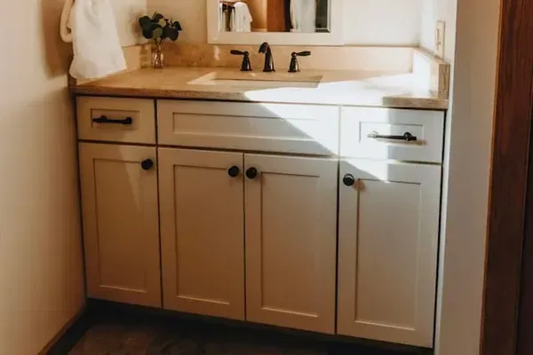 Bathroom 1 can be entered from Bedroom 1 (the primary bedroom) or the hallway