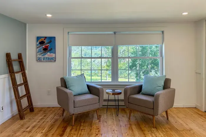 The sitting area in the primary bedroom is a nice spot for a quiet moment with tea or coffee in the morning or an afternoon break with a book