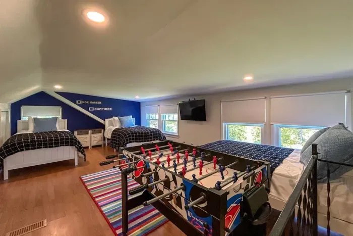 This bonus room is intended for kids and is not included in the bedroom count due to the low ceilings (5'6" at the lowest point). It is accessed via its own staircase just off of the queen bedroom. 