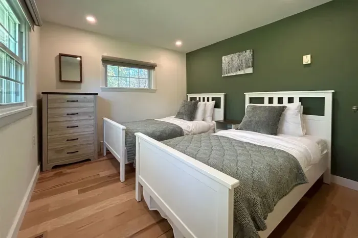 The twin bedroom is located on the ground floor and is separated from the great room by a small TV room