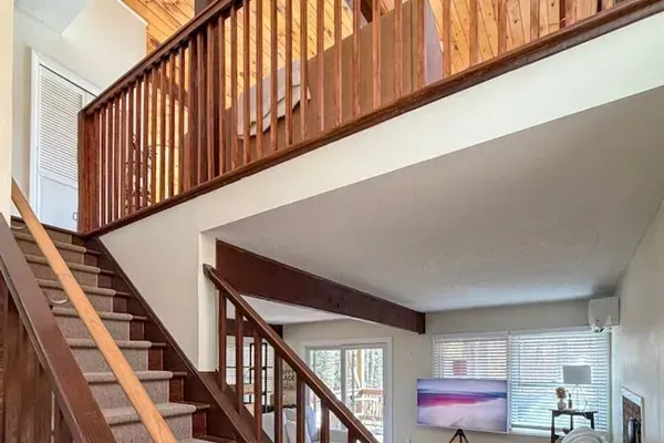 Stairs going up to the second floor (living room, dining room, kitchen, and primary bedroom suite)
