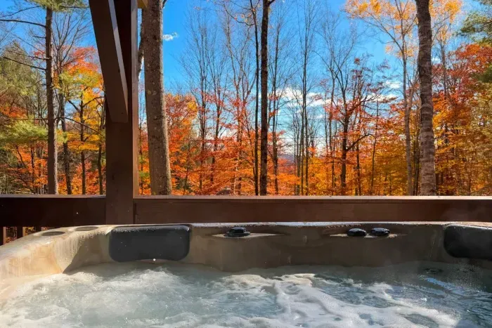 The hot tub is located on the covered lower deck with views of the yard for all-season soaking!