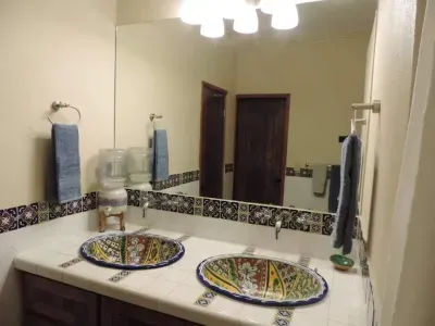 The 1st floor bathroom, with doors to each bedroom. Each door has privacy lock.
