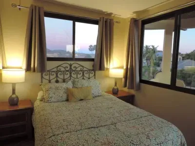 The 3rd floor bedroom with queen bed & lovely views of mountains and ocean.