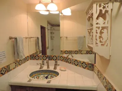 Pretty ensuite bathroom for the 3rd floor bedroom with sink, toilet and shower.