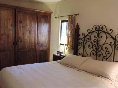 Master Bedroom, 1st floor with comfortable Cal King size bed & built in wardrobe