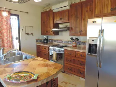 Second floor kitchen with stainless appliances. Fridge with purified water & ice