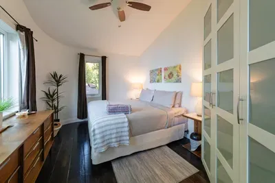 Upstairs, the private primary bedroom offers a king-size bed and a peaceful retreat