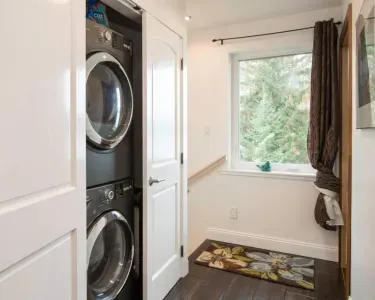 The laundry area is conveniently located upstairs.