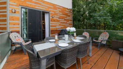 Step out from the dining area to the lakefront deck.