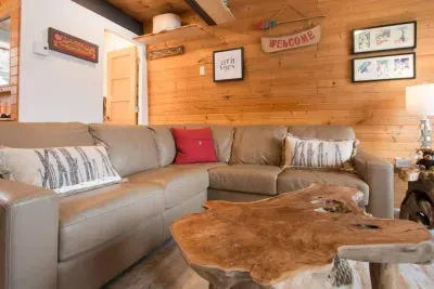 Live edge furniture and a comfortable leather sectional completes the cabin feel.