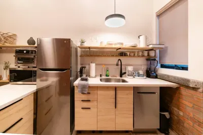 More than a kitchenette... this Kitchen provides fridge, dishwasher, microwave, infrared cook top, and Cuisinart air fryer, toaster, oven that can cook a 12" pizza.