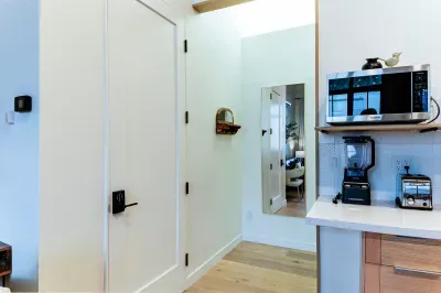 The entry to the bedroom with full length mirror.