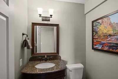 [Main Level Half-Bath] Convenient half-bath located next to the entrance of the main level.