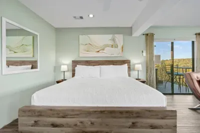 [Bedroom 2] Enjoy a cozy night’s sleep in the plush king bed and a room equipped with a Smart TV.
