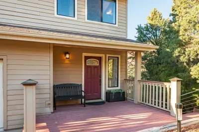 [Front Porch] Walk up to the welcoming front porch featuring a cozy bench right by the entryway.