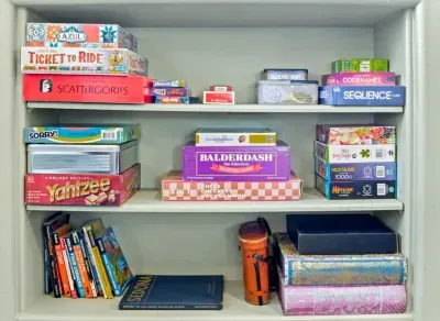 [Bedroom 2] Gather for family game nights with an assortment of popular board and card games.