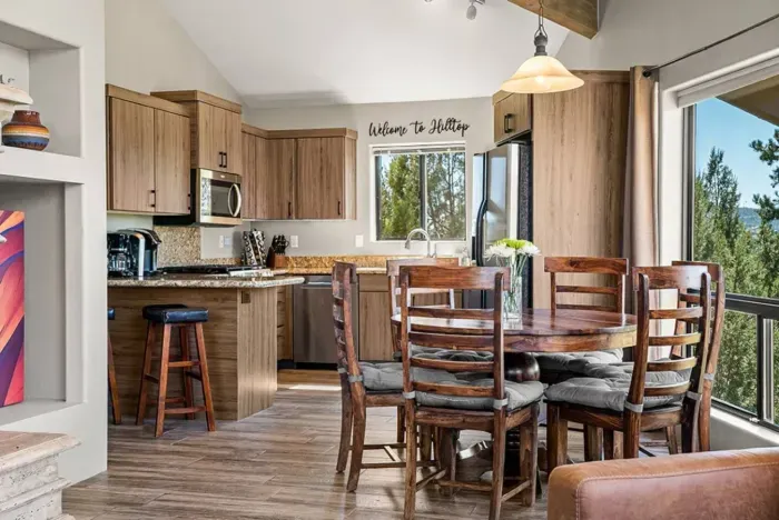 [Main Living Area] The open dining setup sits right beside the kitchen for a seamless dining experience.