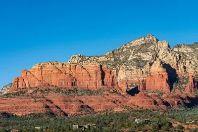 Dynamic desert mountains stretch across the horizon, creating a stunning backdrop for your stay.