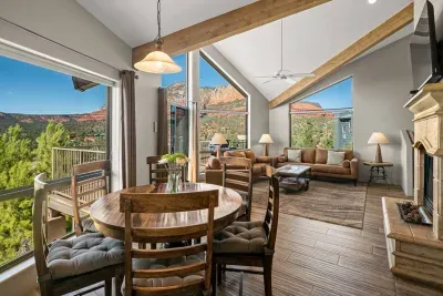 [Main Living Area] The seamless open-concept design connects living, dining, and kitchen spaces for easy group gathering.