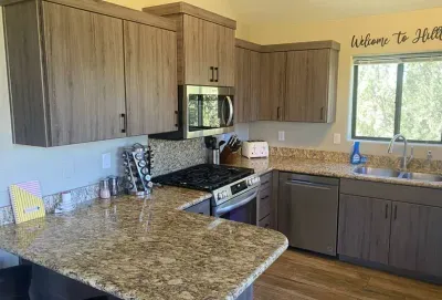 [Kitchen] Cook with ease using granite countertops, stainless steel appliances, and dual coffee makers.