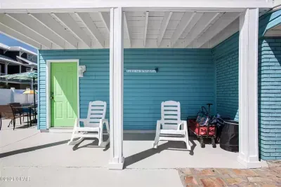 The second outdoor shower is located to the right, which will help keep you and your gear sand and salt free. The control for the pool lighting system is located on the balcony column.