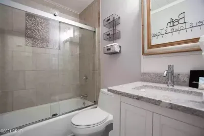 Hall bathroom is a full bathroom with shower/tub combination. There are many hooks on the wall to accommodate guests' towels.