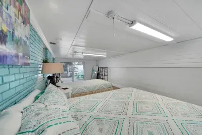 We have added several guest-friendly pieces to this room, including a full-length mirror perfect for heading out on the town and a shelf piece with hanging capacity for guests' belongings.