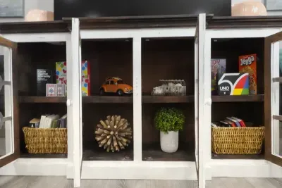 The TV console table houses entertainment for any age and weather!