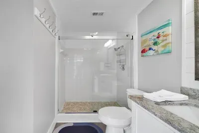 Primary en suite full bathroom with shower.