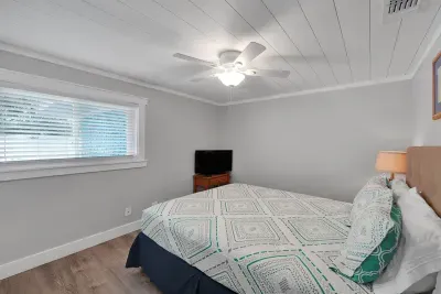 After a fun-filled day at the beach, guests will enjoy relaxing in the private bedroom off the main hall with queen bed and TV.