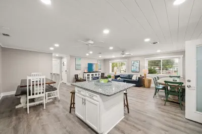 As you walk through the front door, to your left at the front of the house is the keeping room. There is an open concept kitchen/dining/living space large enough for all to gather.