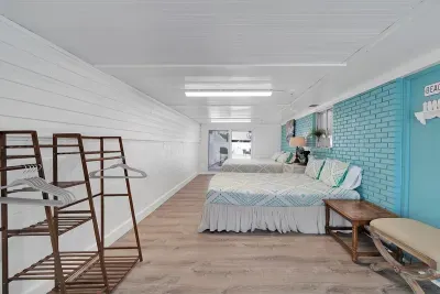 Enclosed porch off of the keeping room creates a "Florida room." Guests will be able to spread out in 1 king and 1 queen bed. Amenities include shelving units and a full size mirror. A "mini-split" A/C unit has also been installed for guest comfort.