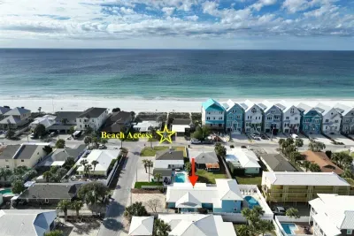 Just 60 steps to beach access! From the front driveway, walk on level ground past one neighboring house and across one local, residential street. Public beach access is ramped; no steps! "We highly recommend this jewel on Ocean Street."- Courtney