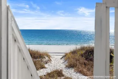 Only a few sandy steps to reach the sugar sand beaches of the Emerald Coast. Surfside Retreat is truly place to relax and recharge. An outdoor shower is pictured below which will help keep you and your gear sand-free after a fun-filled day at the beach.