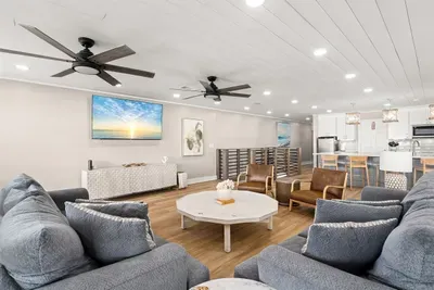 Surfside retreat sleeps up to 14 guests in beds and 2 in the pull-out sleeper sofa. Sheets for the sofa may be found in the upstairs closet. A half-bath just off the keeping room ensures all guests are comfortable during times of gathering.