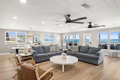 Gather around the over-sized coffee table for a game of cards or to watch a favorite show on a rainy day. The fans overhead will keep you cool while fast Wifi and easy access to the kitchen will keep all creature comforts close at hand.