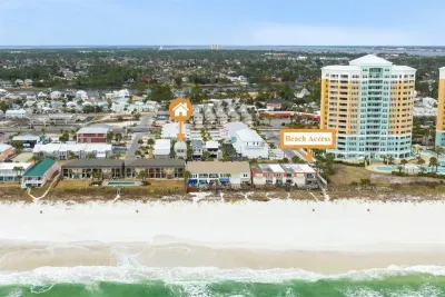 Located just one row back from the beach, cross a residential street and the beach access point is just 90 steps away on a flat walk.