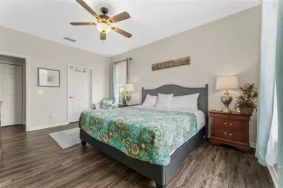 The primary bedroom has a full size closet, Roku TV, and en suite bathroom.